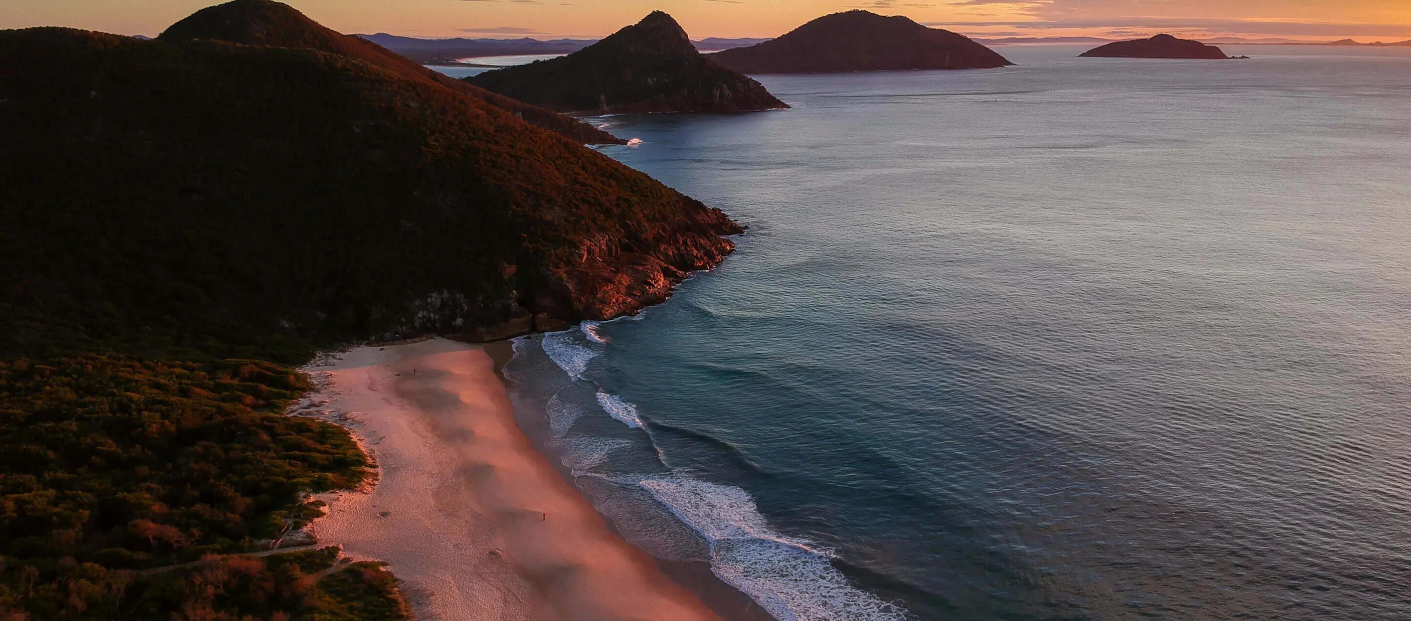 Sunrise over mountain and beach in New South Wales, Australia